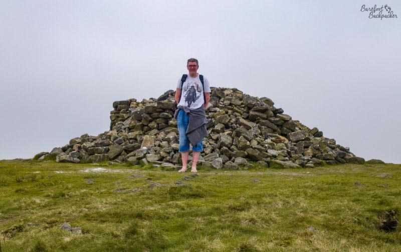 Two Lads Cairn, Winter Hill, with barefoot backpacker