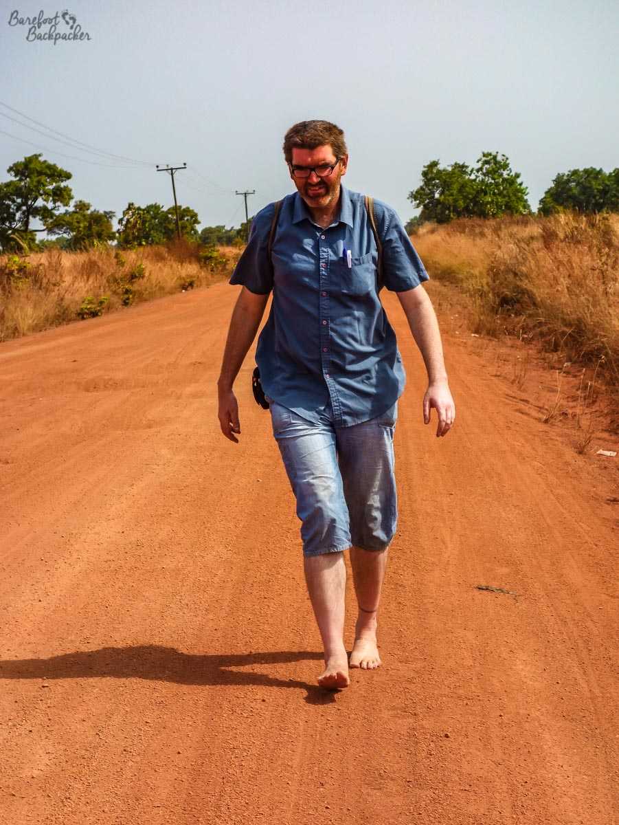 Barefoot on a road in Ghana.