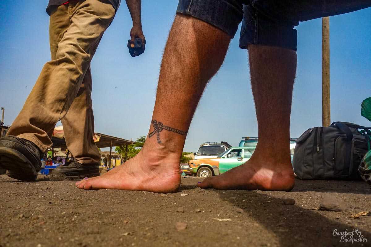 Barefoot at a bus Station