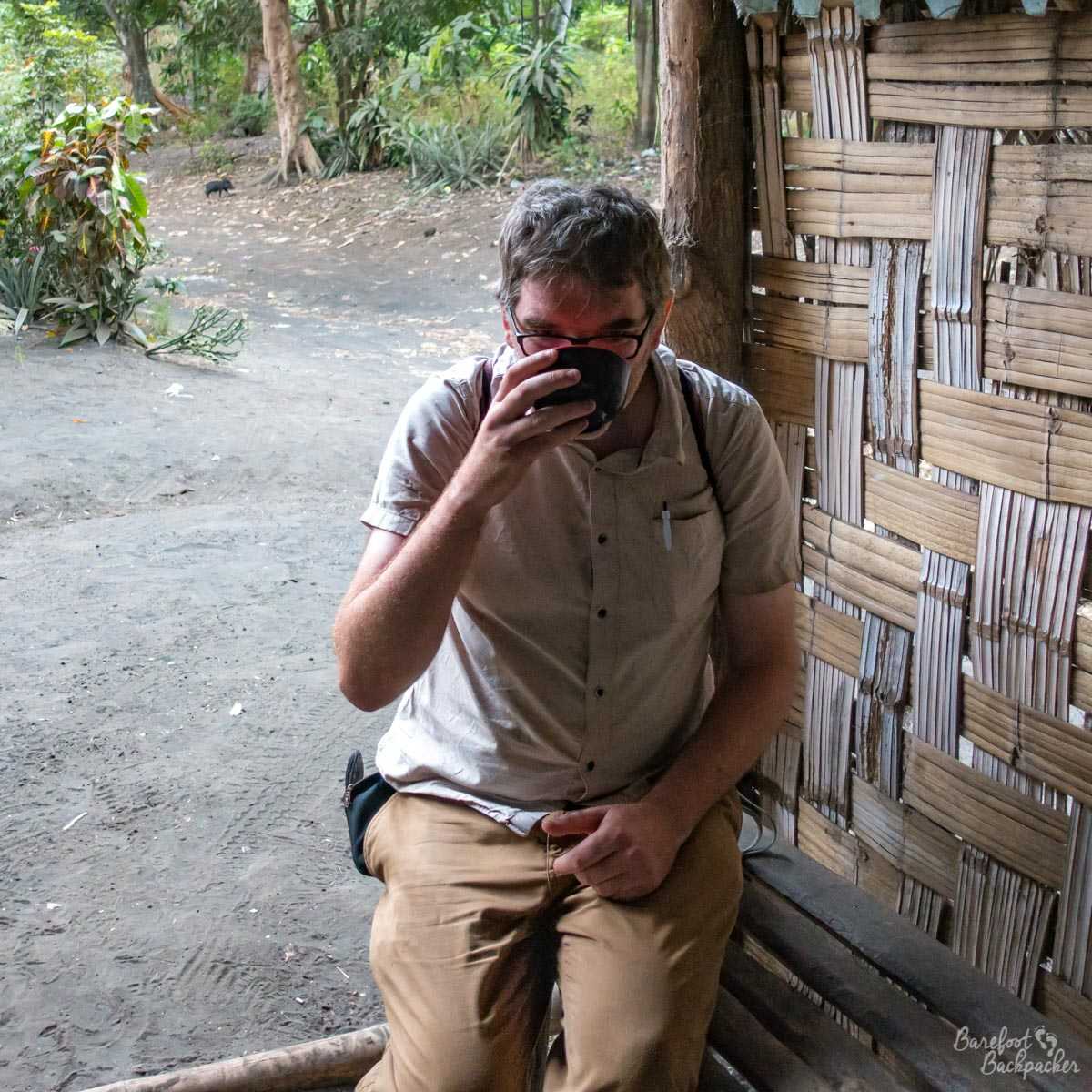 The Barefoot Backpacker drinking kava.