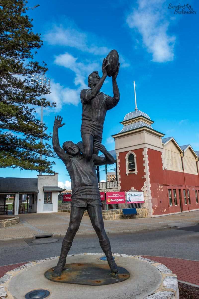 Statue of an AFL 'mark', outside the Fremantle Oval.