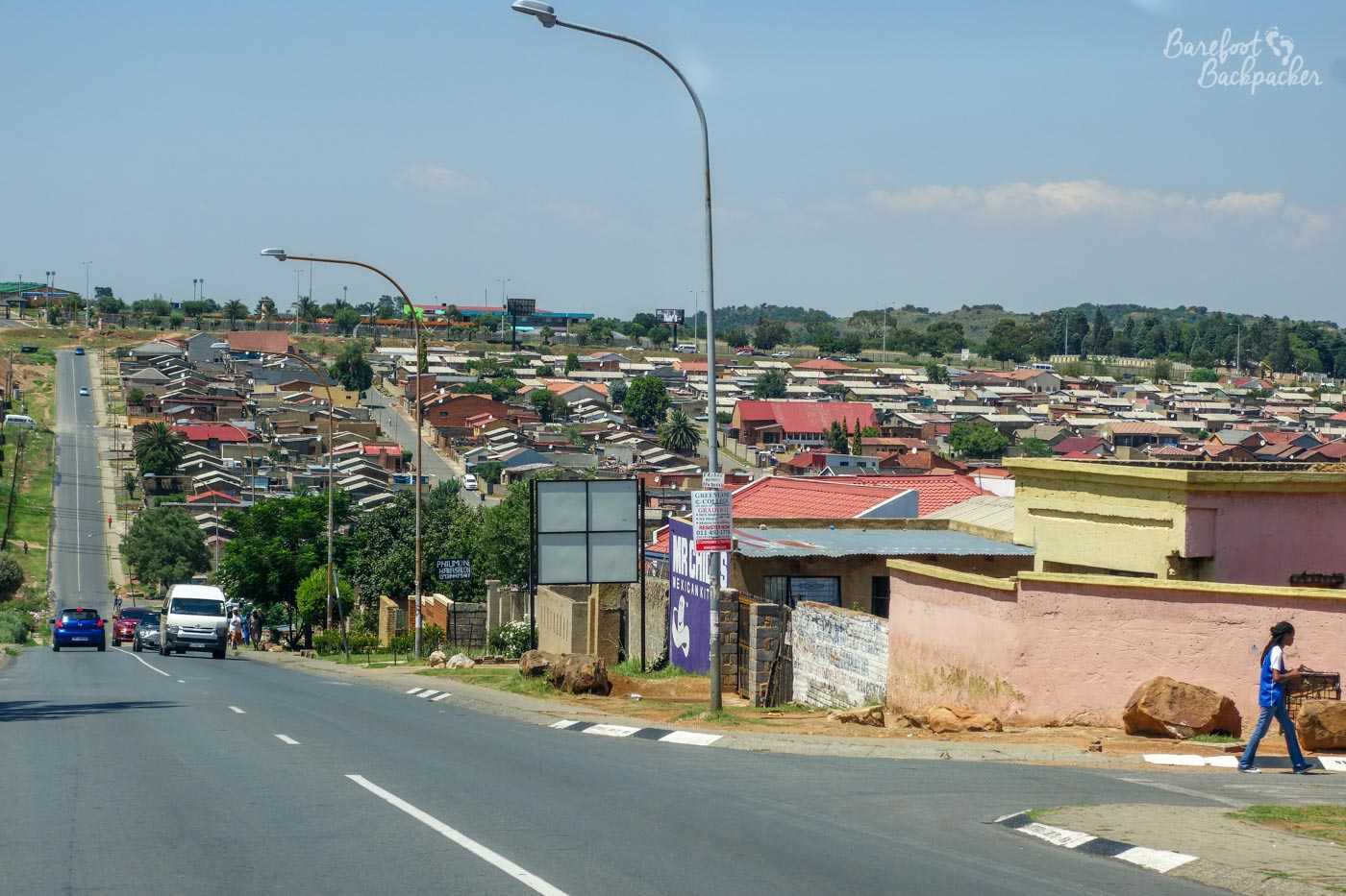 Overview of part of Soweto, looking out over some of the houses from a street in the outskirts