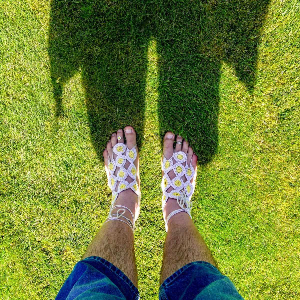 Daisy-themed Barefoot Sandals, on the grass