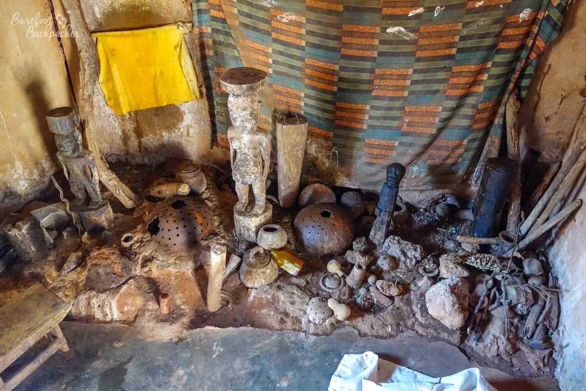 Fetishes and idols around the floor of the Vodun priest's hut.