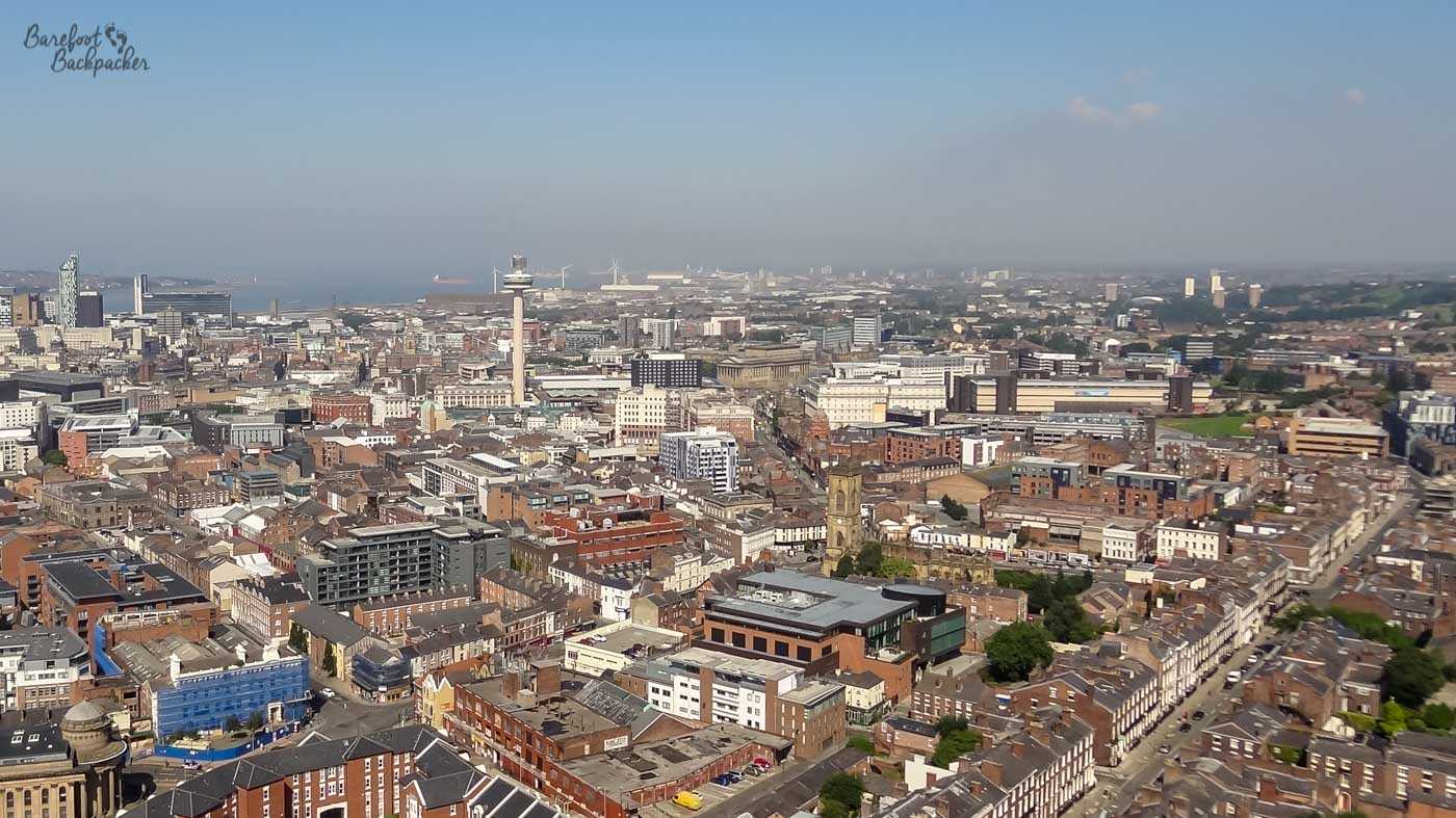 View from the top of Liverpool's Anglican Cathedral over the cityscape of northern Liverpool, looking towards Crosby and Bootle. Ships at Seaforth Container Base are in the far distance.