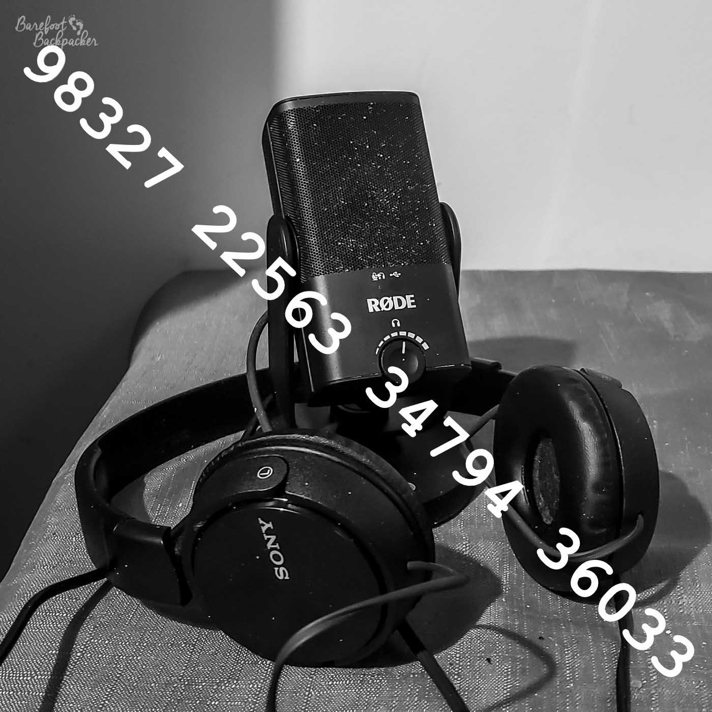 Image of a microphone and headphones on a desk, with the numbers 98327 22563 34794 36033 overprinted.