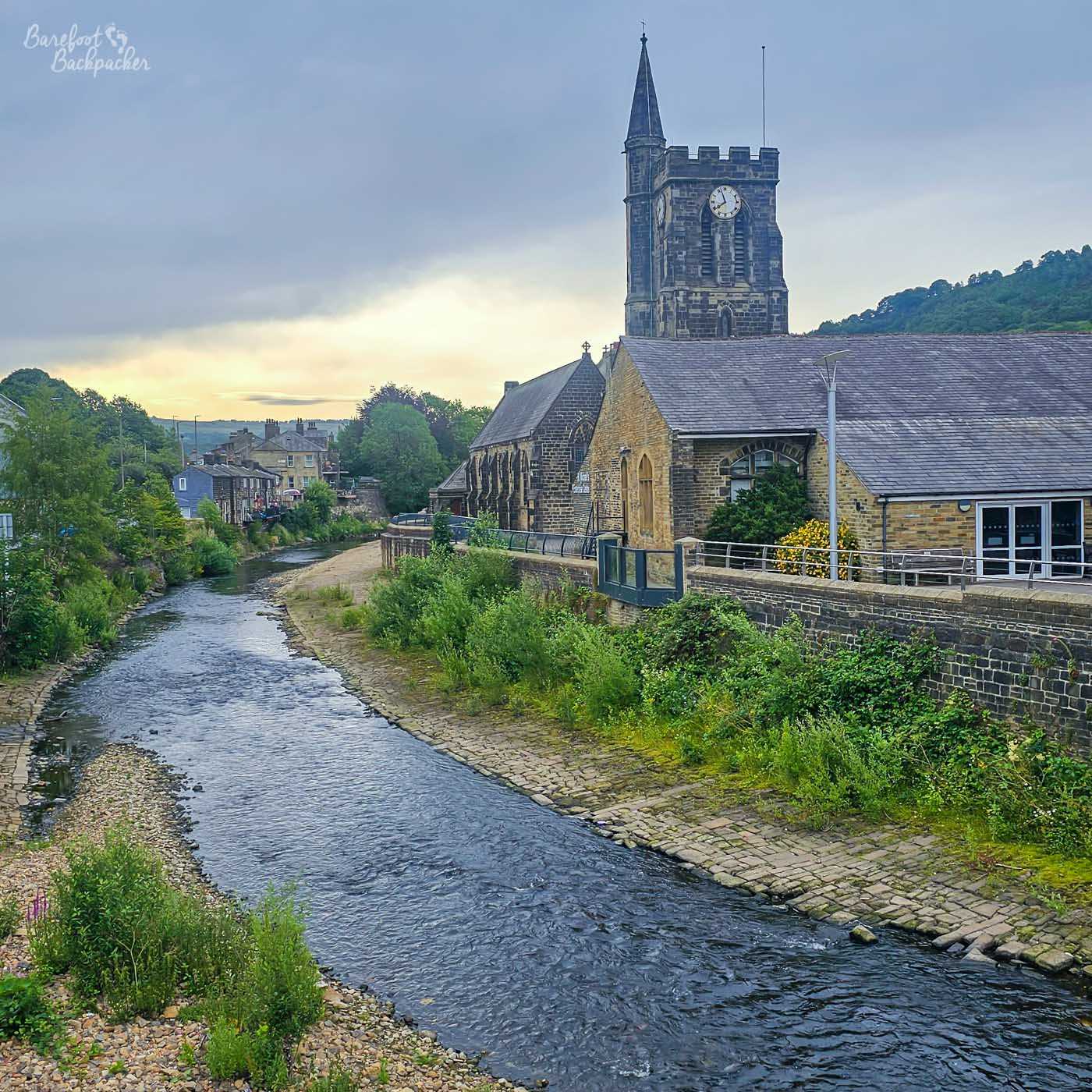 The River Calder flowing past St Michael's Church in Mytholmroyd.